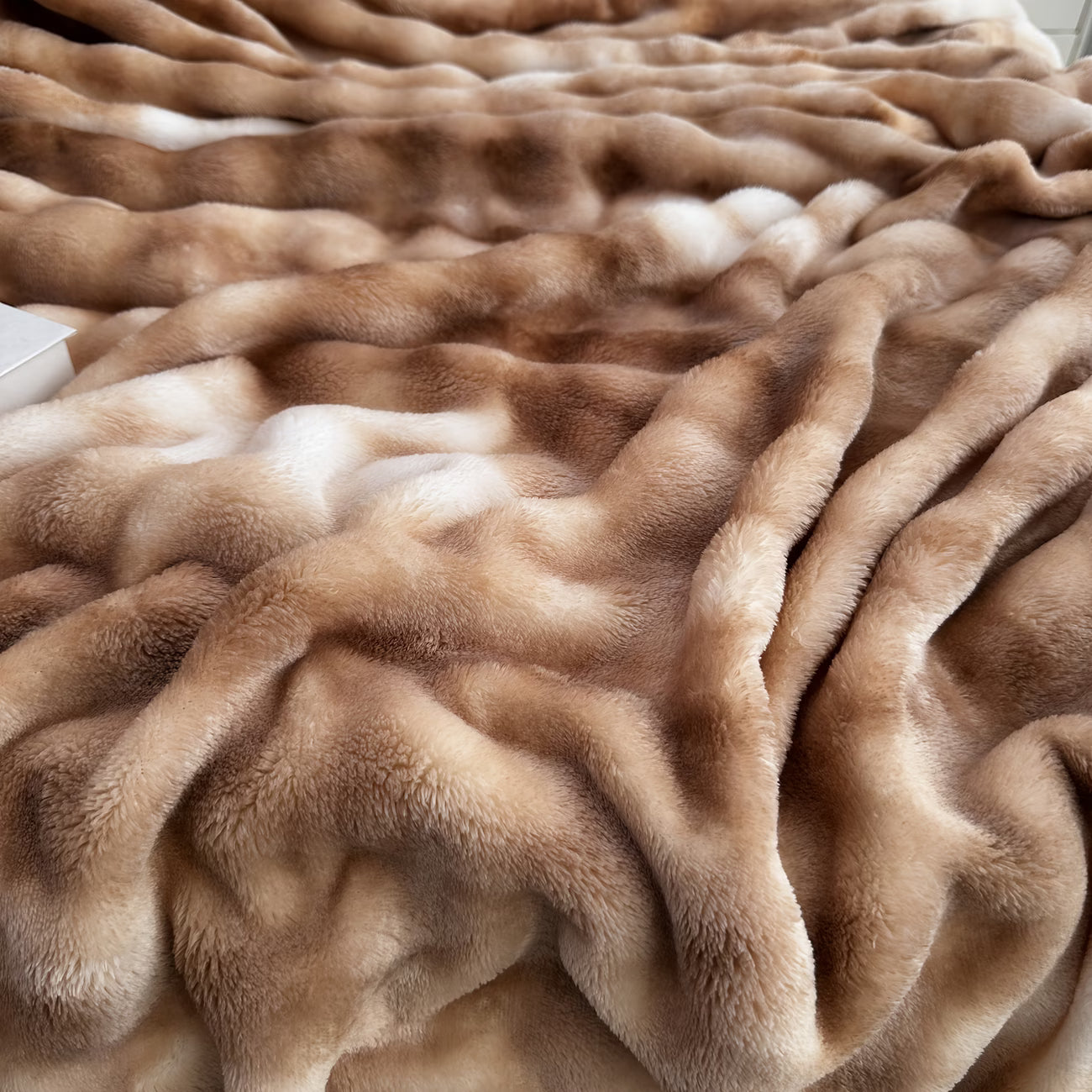 Close-up of a fluffy brown blanket with soft texture
