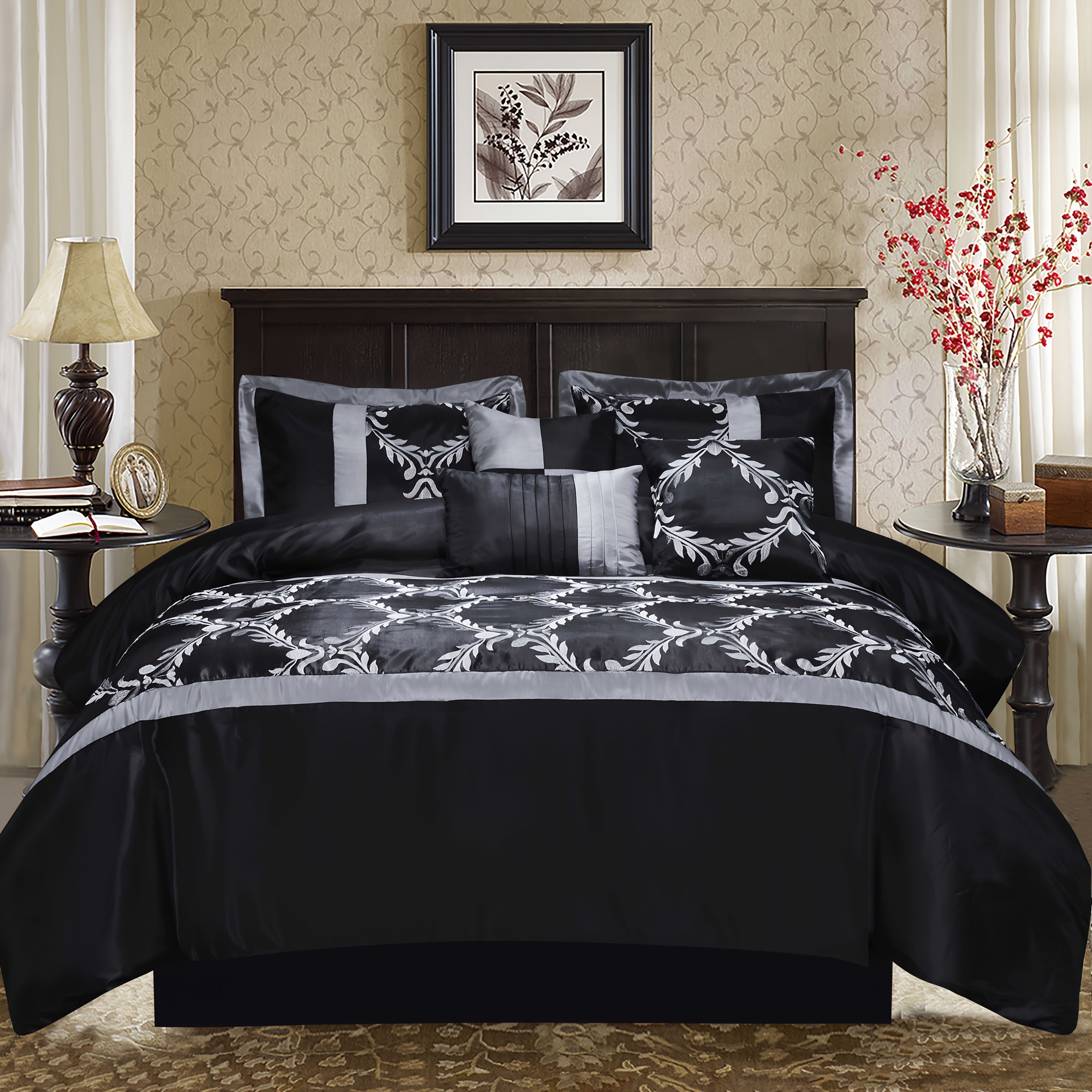 Black and gray patterned bedding set on a bed in a bedroom with decorative elements.