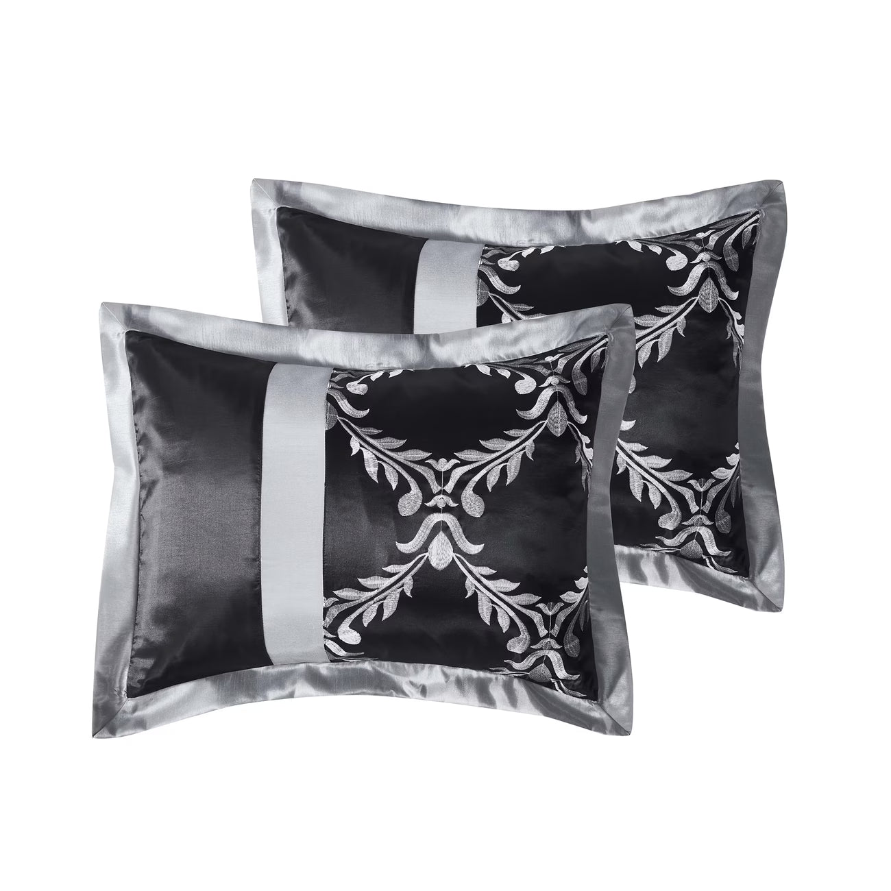 Two black satin pillows with silver floral patterns on a white background