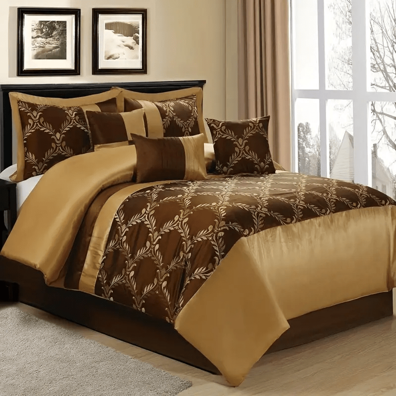 Brown and gold patterned bedding set on a bed with matching pillows.