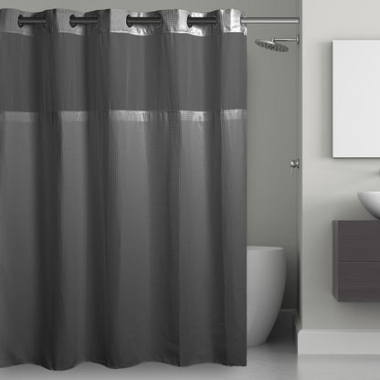Gray shower curtain with mesh panels in a bathroom setting