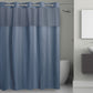 Gray shower curtain with mesh panels in a bathroom setting