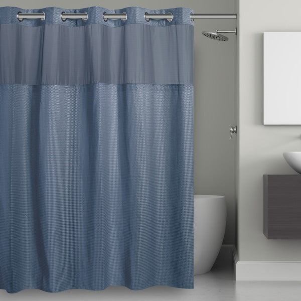 Gray shower curtain with mesh panels in a bathroom setting