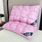 Pink quilted pillows with 'Hunde' branding on a bed.
