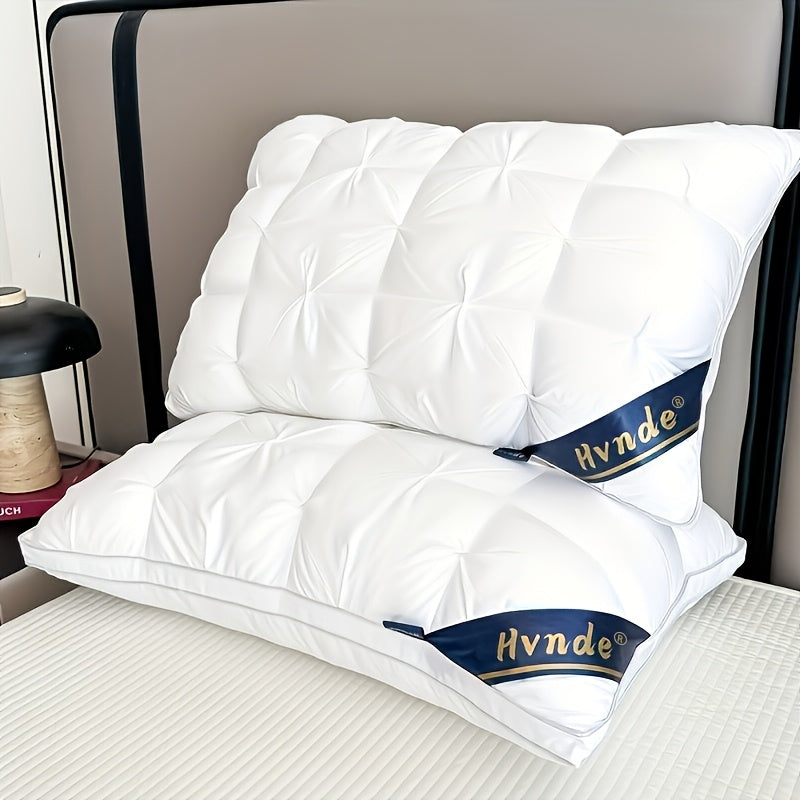 White pillows with Hynde branding on a bed