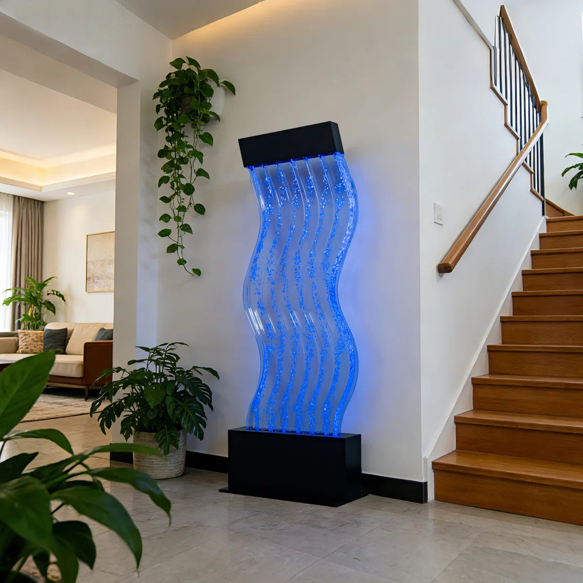 Futuristic water fountain with blue light in a modern home setting