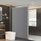 Modern bathroom with a vertical radiator and a window.