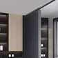 Modern bathroom interior with shower area, cabinets, and lighting fixtures.