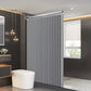 Modern bathroom with a vertical radiator and a window.