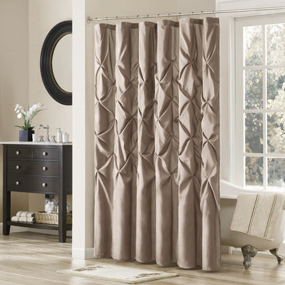 Brown textured shower curtain in a bathroom setting with a window and vanity.