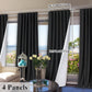Black curtains with measurements and a living room setting