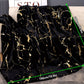 Black and gold patterned blanket on a sofa with measurement details.