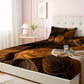 Bed with brown leaf-patterned comforter in a bedroom setting.