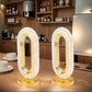 Two decorative table lamps with a modern interior setting.