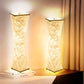 Two decorative lamps with a natural branch design on a surface.