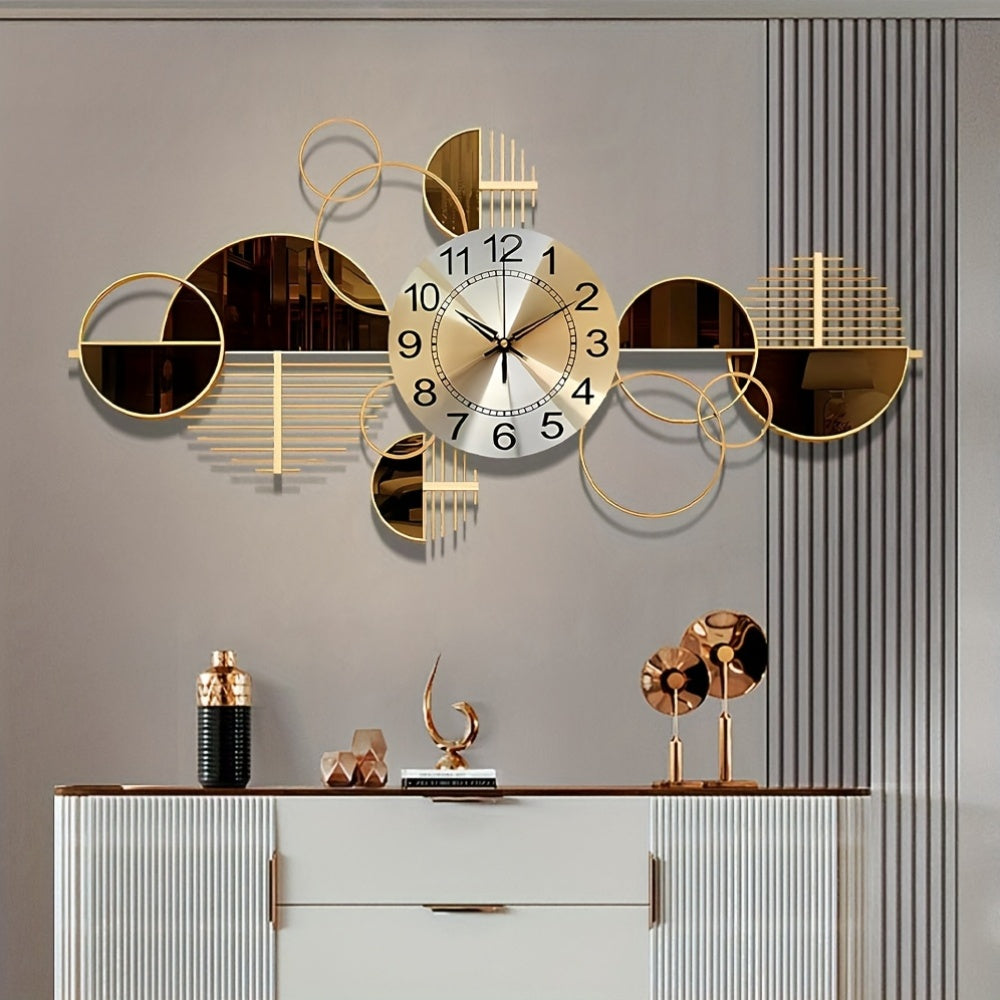 Decorative wall clock with geometric design on a gray wall above a white cabinet.