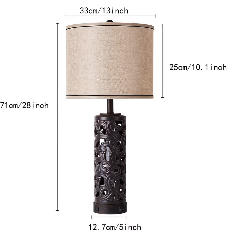 Table lamp with decorative base and beige shade, showing dimensions on a white background