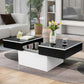 Modern living room with a black and white coffee table, sofa, and decorative elements.