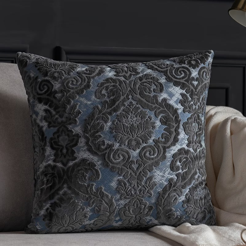 Decorative pillow with intricate pattern on a couch