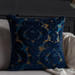 Decorative blue and gold pillow on a sofa