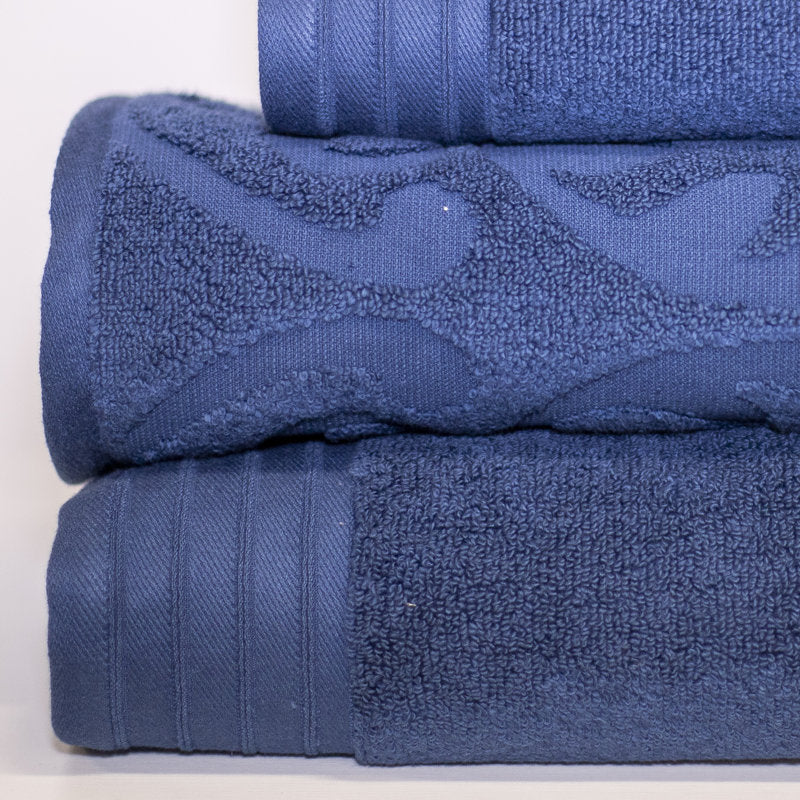 Stack of blue towels on a light gray background