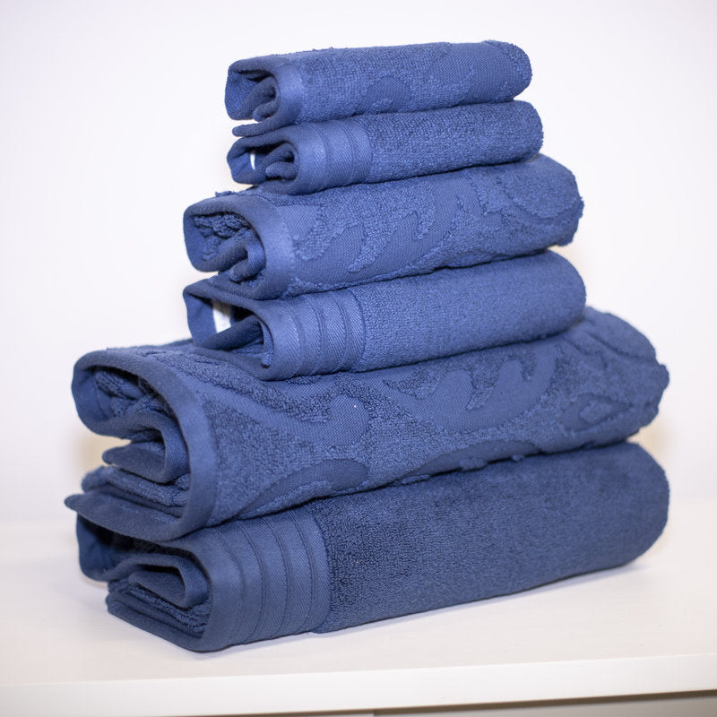 Stack of blue towels on a white background