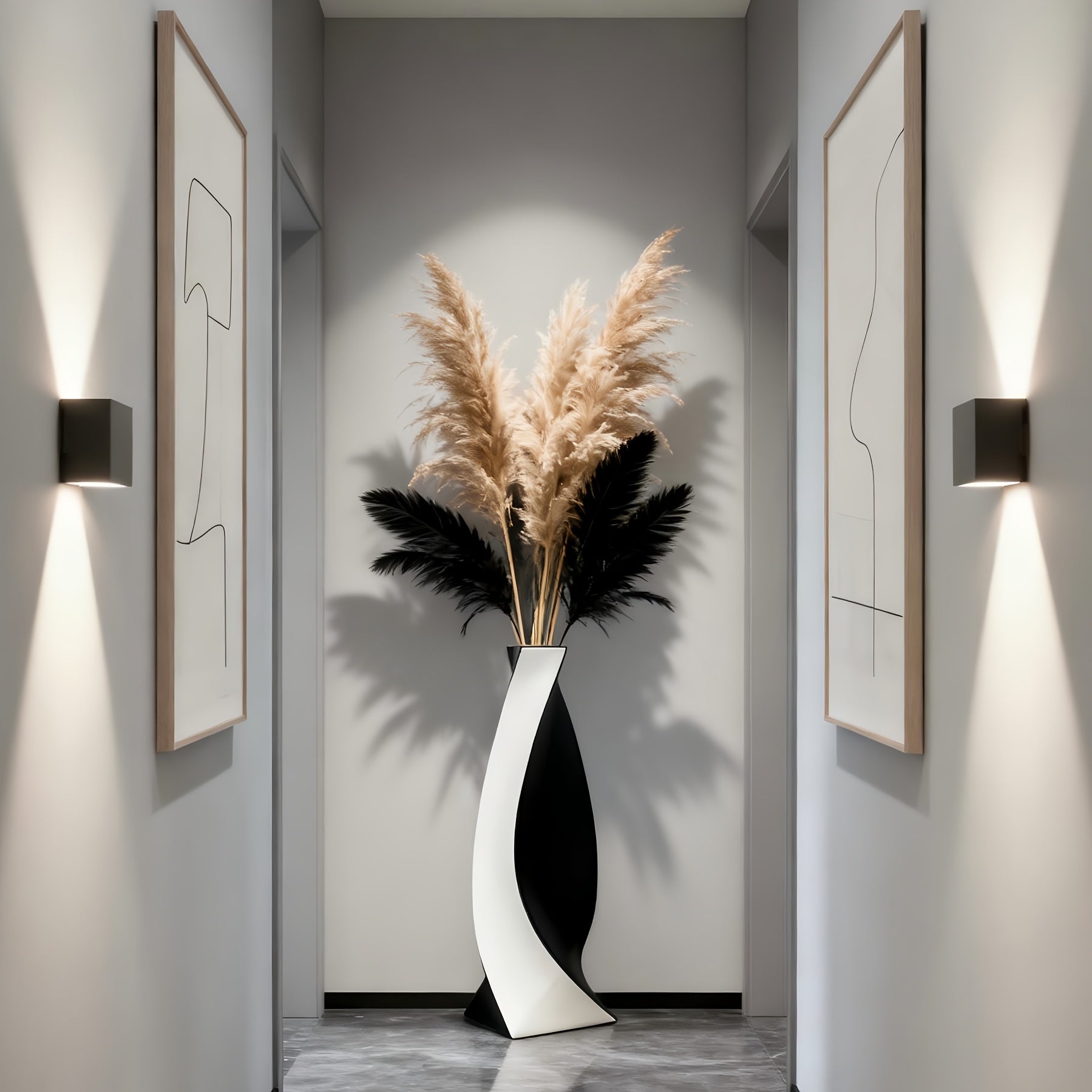 Modern interior with a vase of pampas grass and abstract art on gray walls.