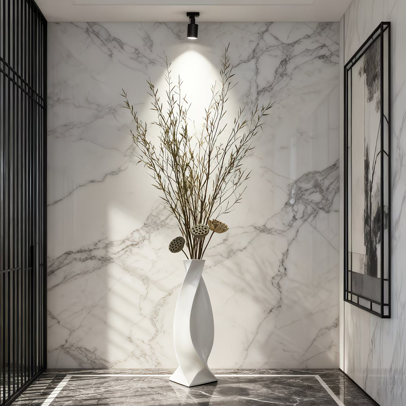 Decorative vase with dried plants against a marble wall