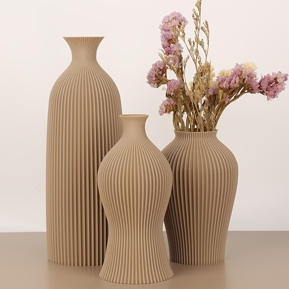 Three beige textured vases on a light background