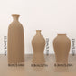Three brown vases of different sizes with measurements on a white background
