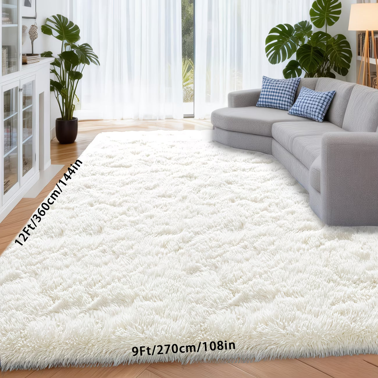 White shaggy rug in a living room with a gray sofa and plants.