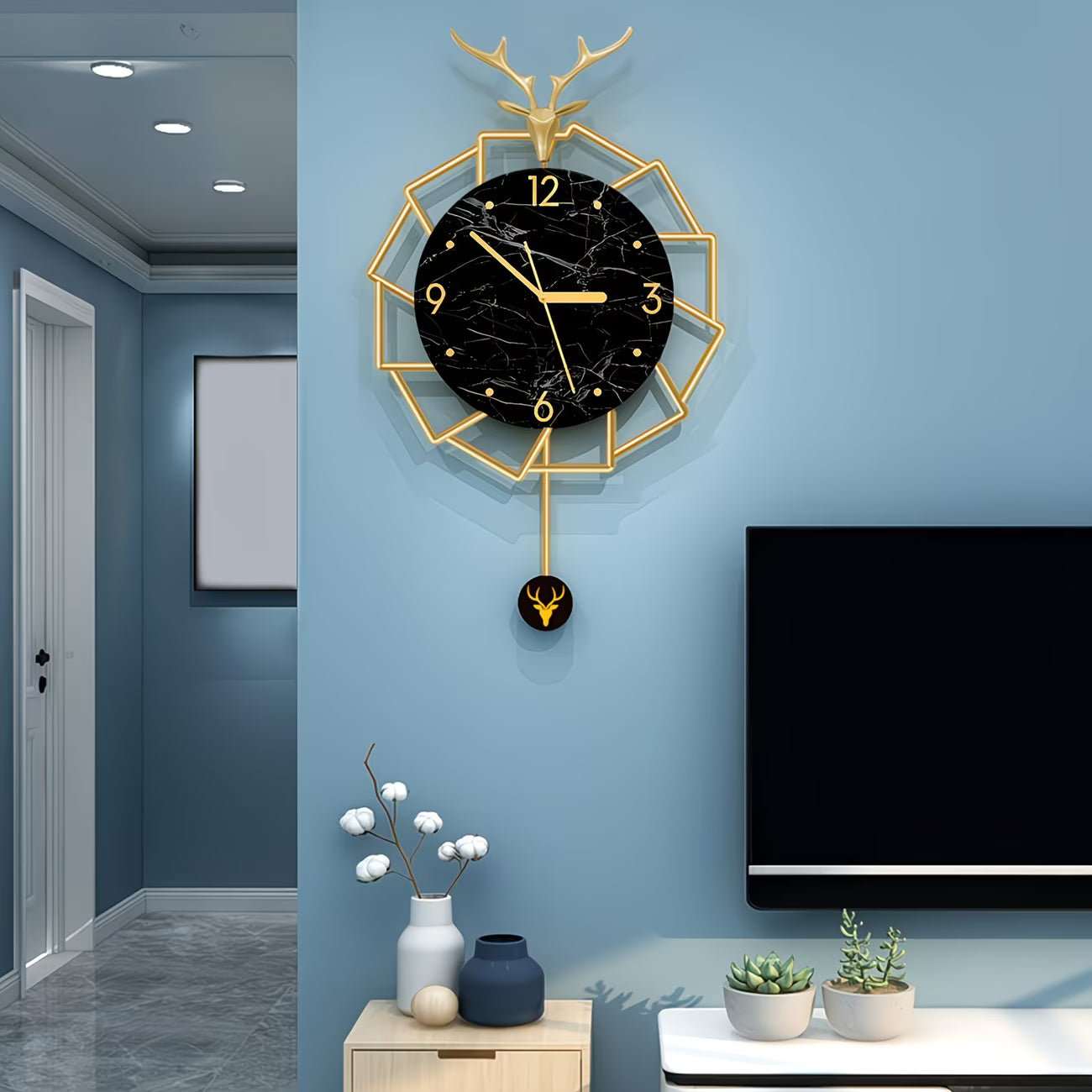 Decorative wall clock with gold frame and black face in a modern living room.