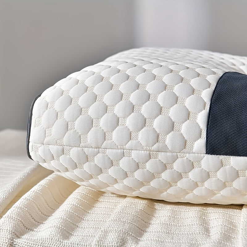 White quilted pillow on a bed with a neutral background