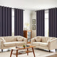 Living room with beige sofas, a wooden coffee table, and dark purple curtains.
