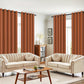 Living room with beige sofas, a wooden coffee table, and orange curtains.