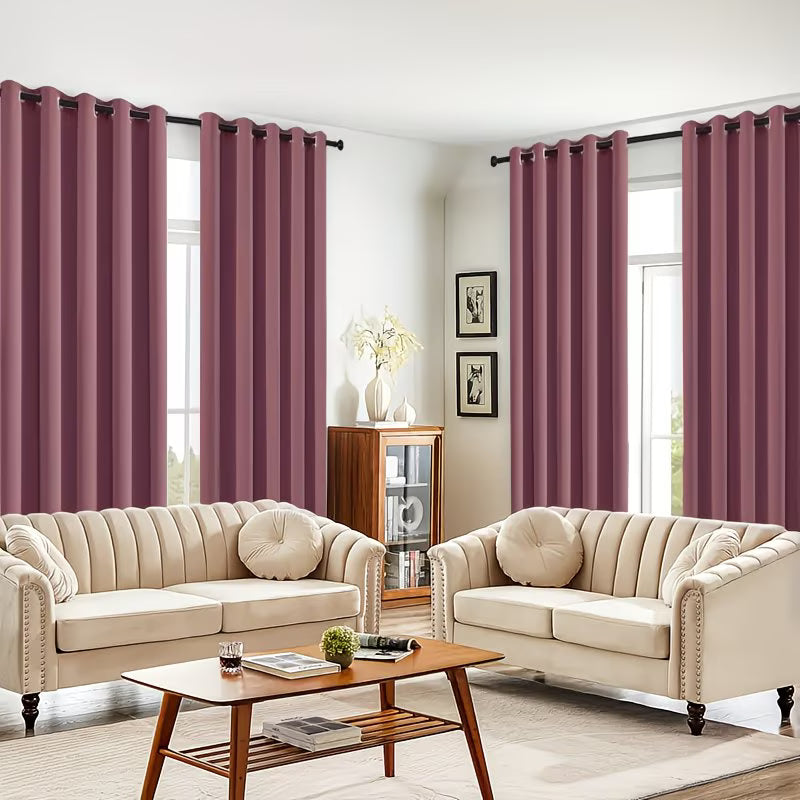 Living room with beige sofas, a coffee table, and purple curtains.