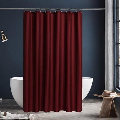 Red shower curtain in a bathroom with a white bathtub and dark blue walls.