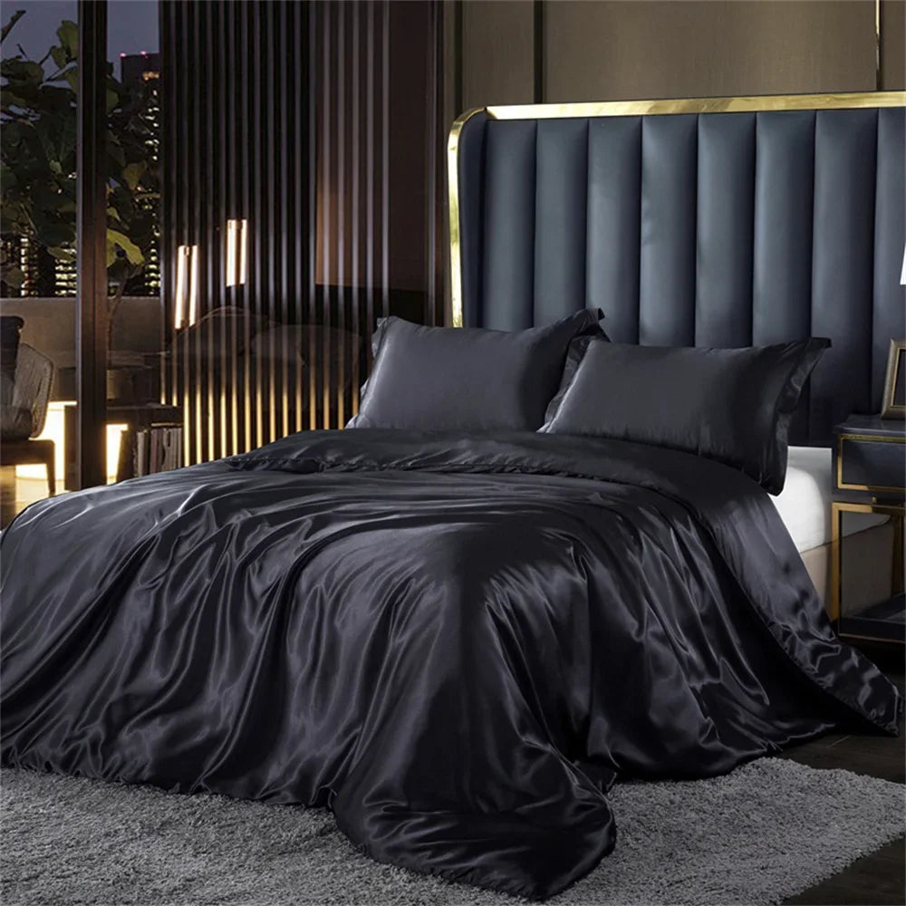 Dark satin bedding set on a bed with a modern headboard in a stylish bedroom.