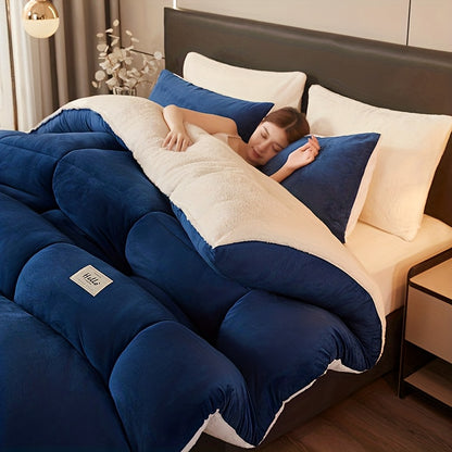 Person lying on a blue and white bedspread in a bedroom setting