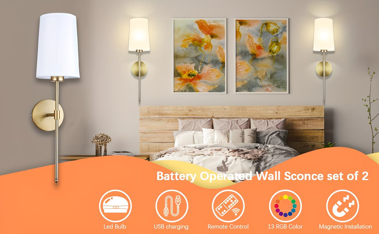 Bedroom setting with wall sconces, floral artwork, and a bed with a wooden headboard.