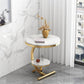 Round side table with marble top and gold base in a modern interior setting.