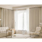 Modern living room with beige curtains, sofa, and armchair.