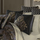 Decorative pillows with intricate patterns on a sofa against a neutral wall.