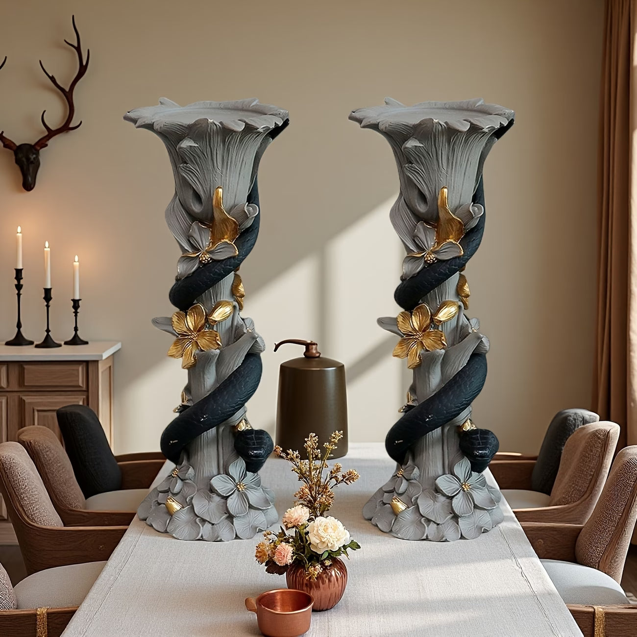 Two decorative candle holders on a table with a warm interior setting.