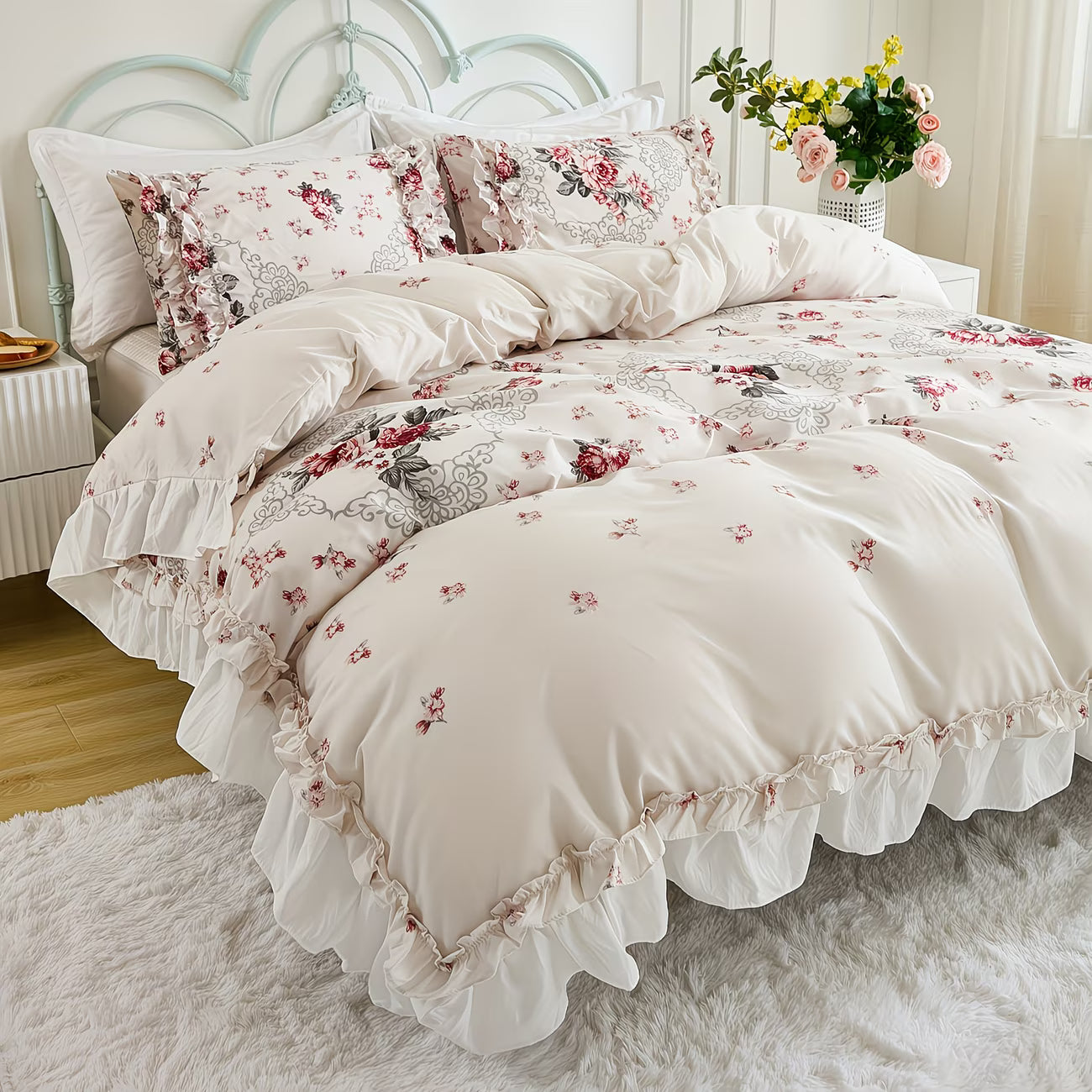 Floral patterned bedding set on a bed with a white headboard.