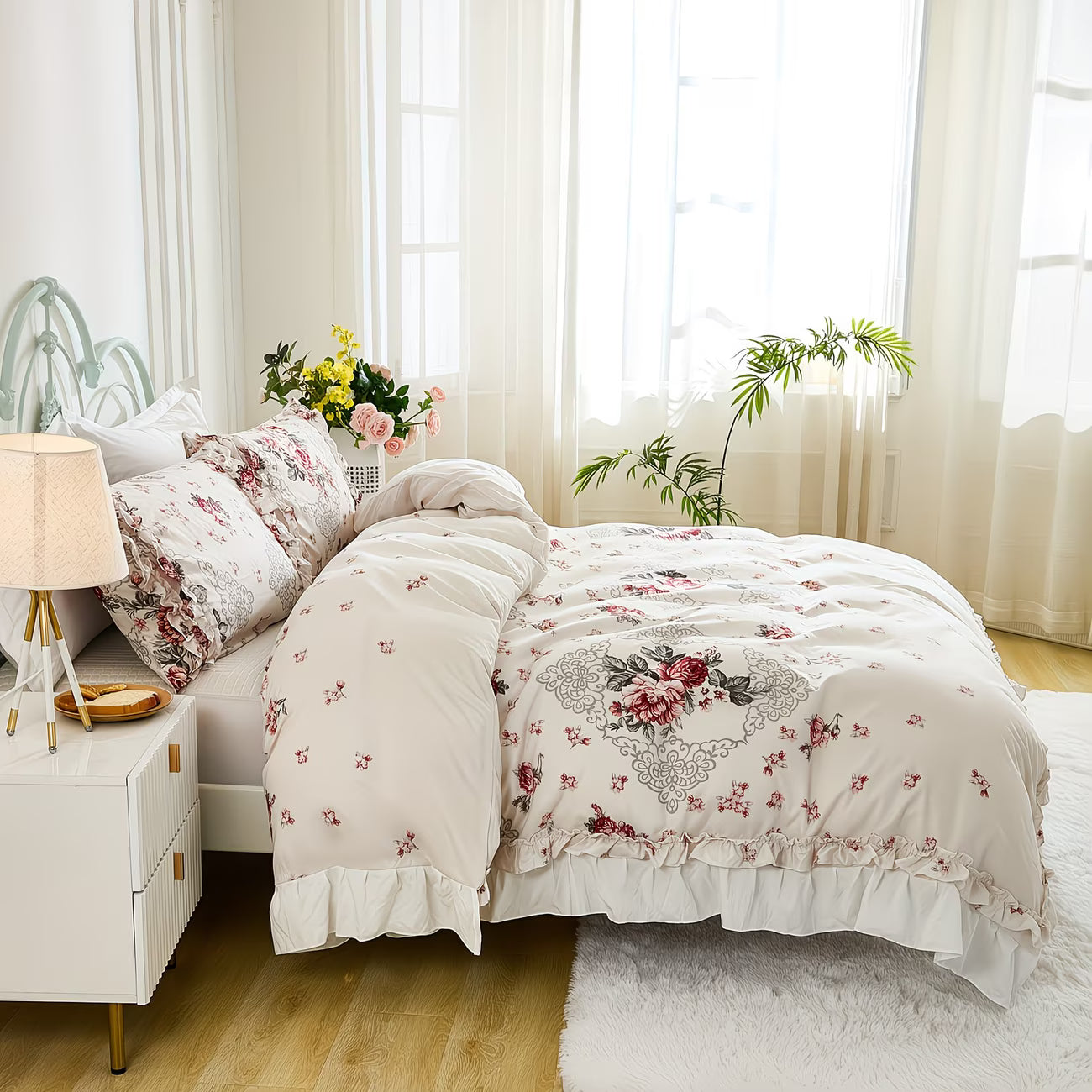 Bedroom with floral bedding, white nightstand, and large windows.