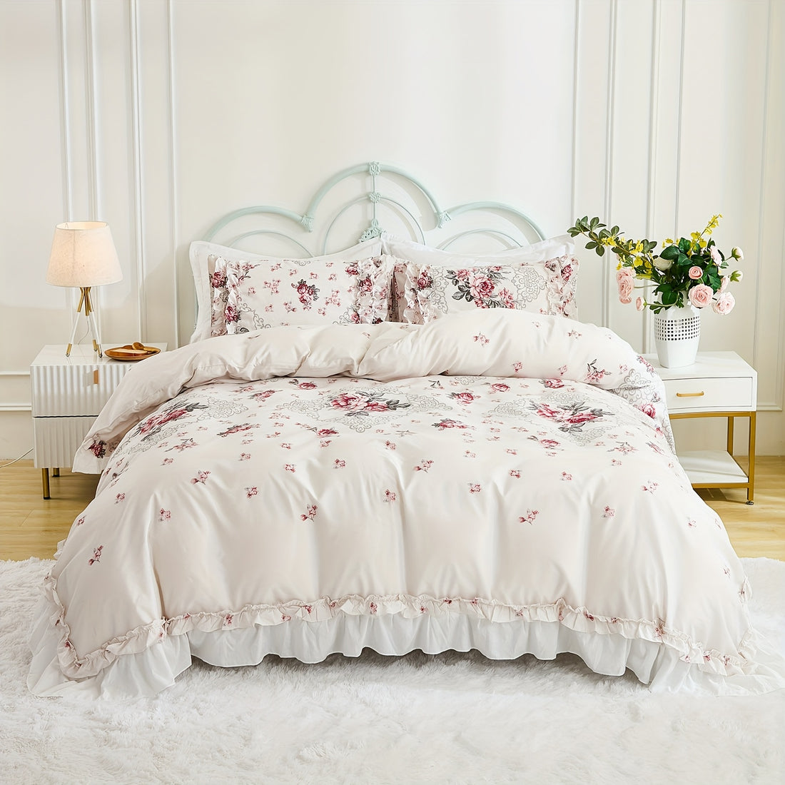 Floral bedding set on a bed in a bedroom with side tables and decor.