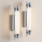 Two modern wall lights with glass panels on a neutral background