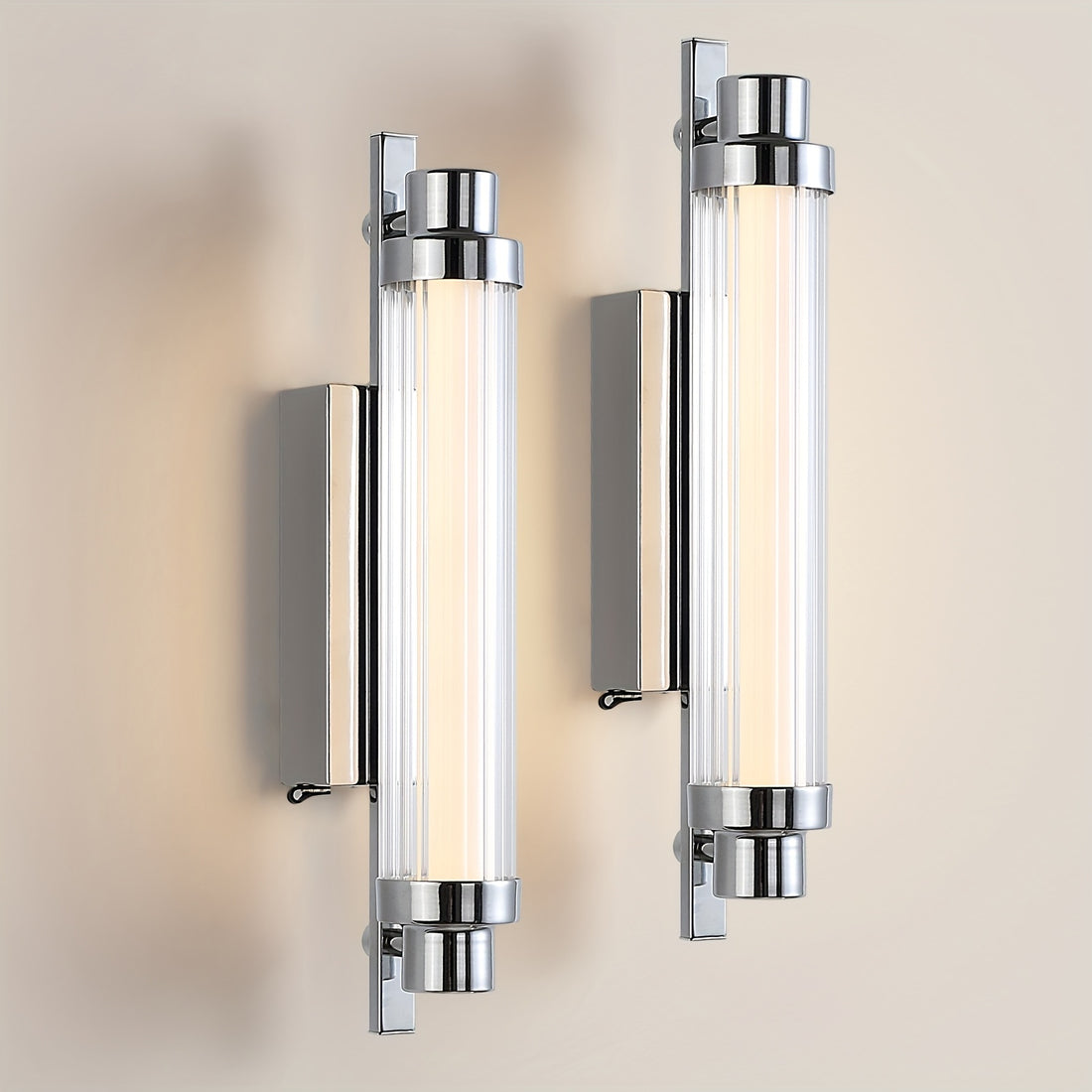 Two modern wall lights with glass panels on a neutral background