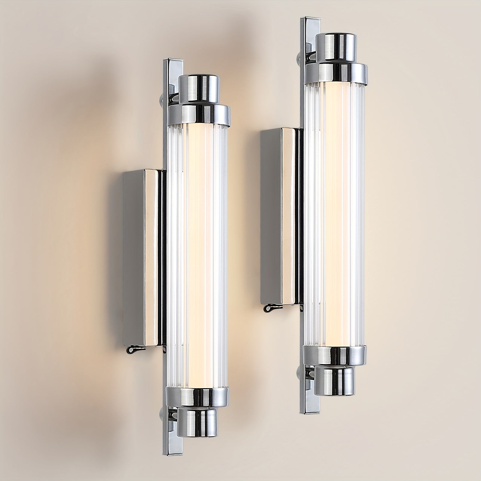 Two modern wall lights with glass panels on a neutral background